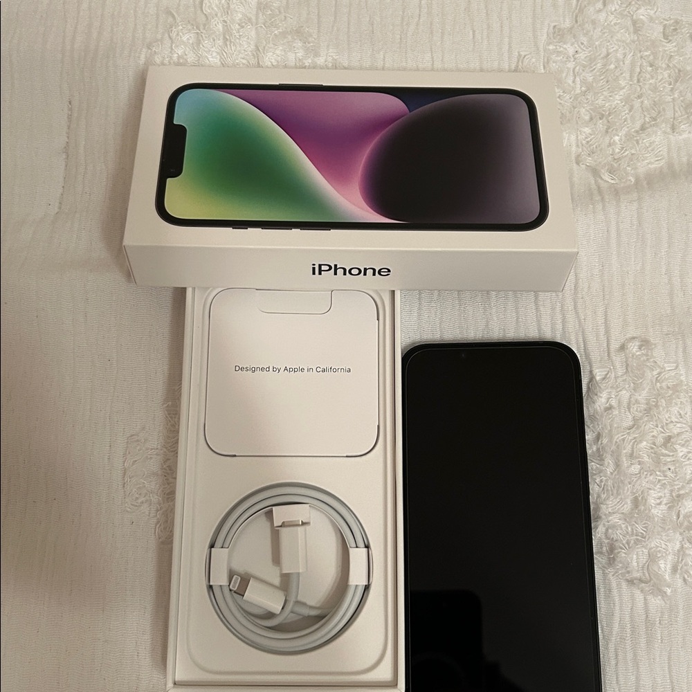 Apple iPhone with Black Screen and White Packaging